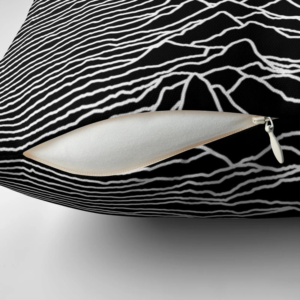 A dark, abstract art-inspired pillow featuring a design inspired by the iconic album cover of the 1970s-1980s indie rock band