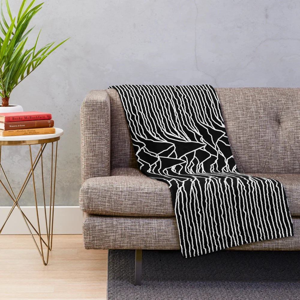 Plush blanket featuring the iconic abstract album art design of the Unknown Pleasures album