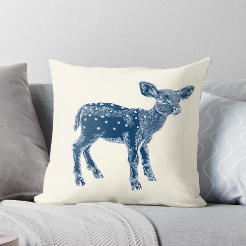 Decorative indigo and cream pillow featuring a cute baby deer illustration