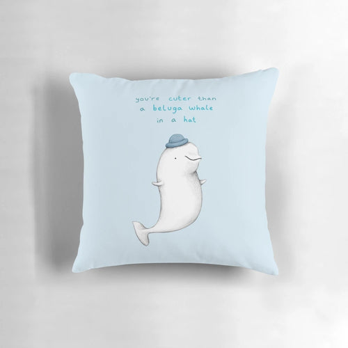 A soft, plush pillow featuring the adorable face of a beluga whale.