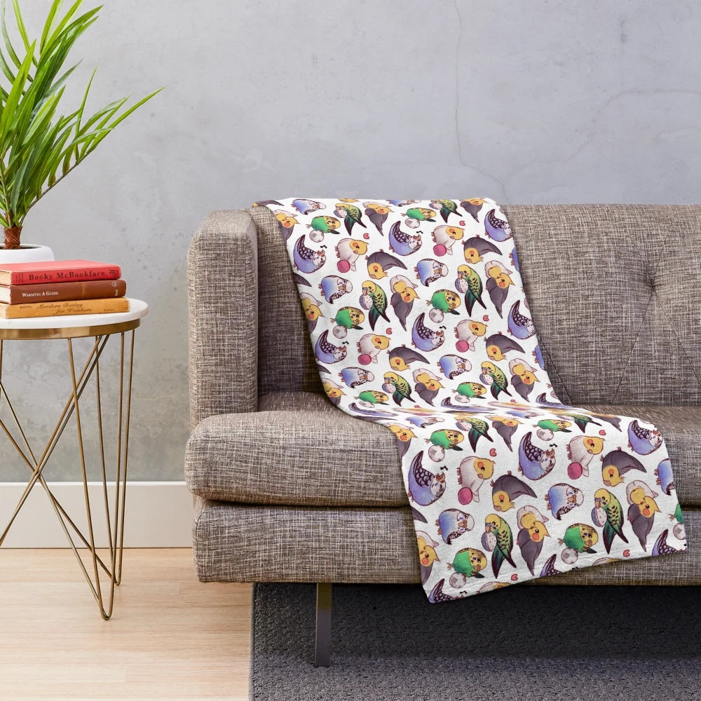 Soft and cozy plush blanket featuring a pattern of cute budgies and cockatiels