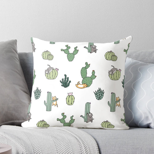 Colorful pillow featuring cute cats among cacti plants