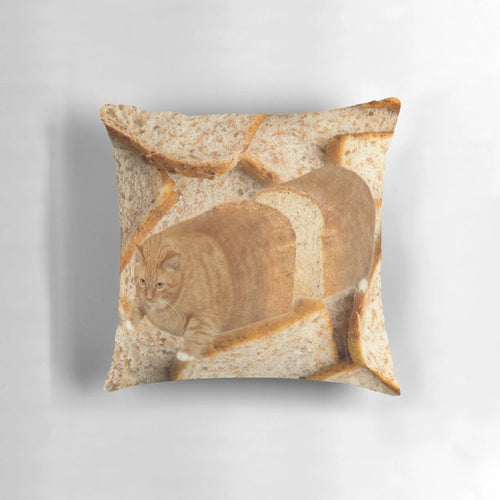 A plush, cat-shaped pillow depicting a cat in a "loaf" position, wearing sunglasses.