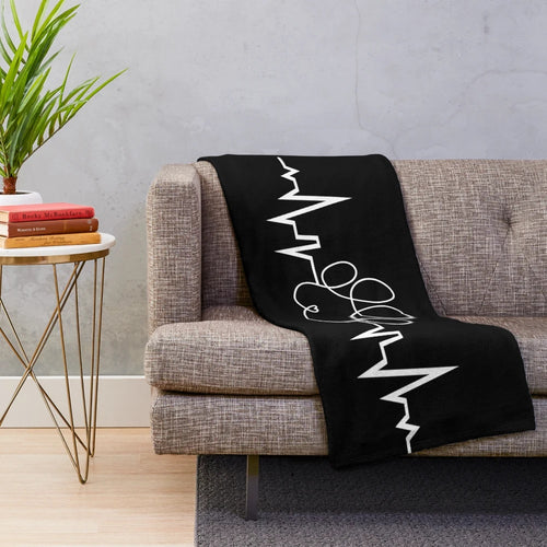 Soft and cozy plush blanket with a dog paw heart design