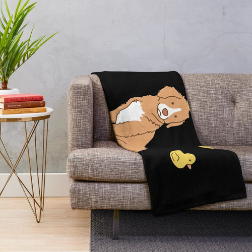 Plush blanket featuring a cute duck tolling retriever puppy and rubber ducks