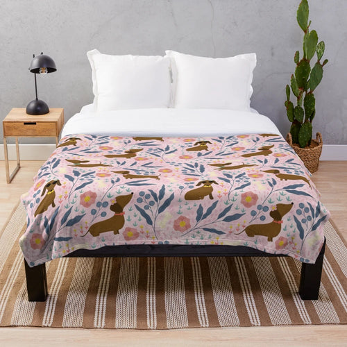 Floral pattern plush blanket featuring sausage dogs