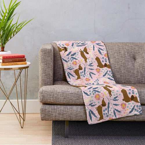 Floral pattern plush blanket featuring sausage dogs
