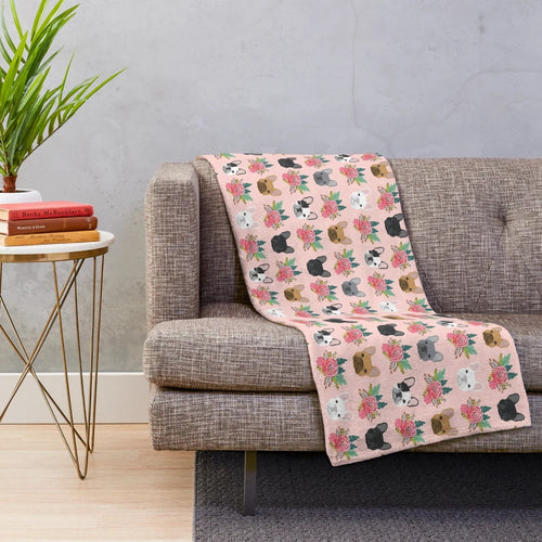 Plush blanket featuring a pink floral pattern and adorable French Bulldog faces