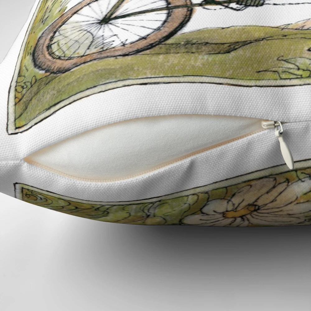 A charming pillow featuring two friends, a frog and a toad, biking together in a whimsical, cottagecore-inspired design.