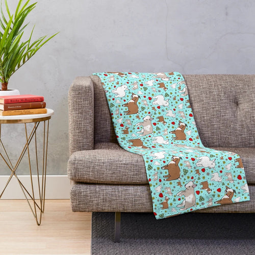 Soft and cuddly plush blanket with a blue and white goat pattern design