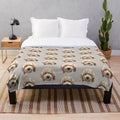 Soft and cuddly golden labradoodle face on a plush blanket