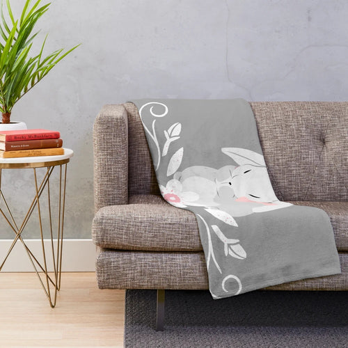 Soft and cozy grey and white bunny rabbit plush blanket with white floral design