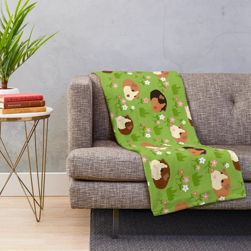Soft and cozy plush blanket featuring an adorable guinea pig surrounded by beautiful spring flowers