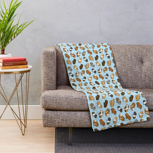 Soft and cuddly plush blanket featuring an adorable guinea pig repeat pattern design