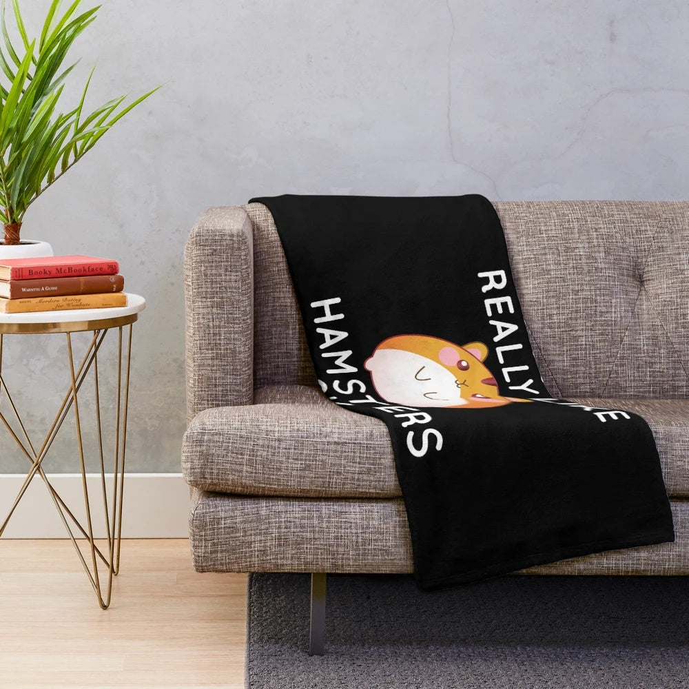 Cozy plush blanket featuring a cute hamster design