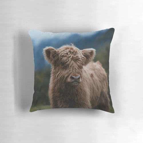 Soft and fluffy highland cow calf pillow, perfect for snuggling and decorating