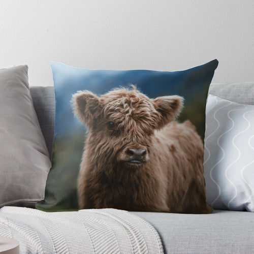 Soft and fluffy highland cow calf pillow, perfect for snuggling and decorating