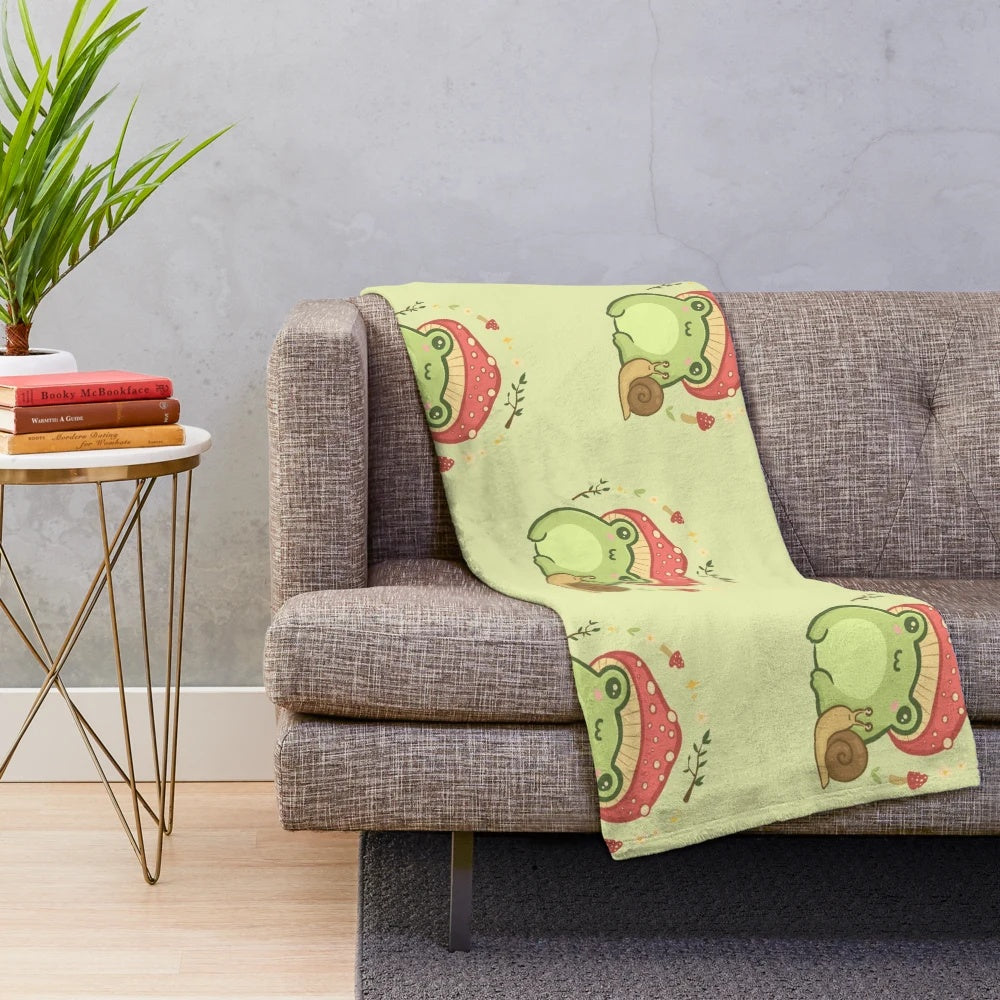 Cute kawaii frog plush blanket featuring a frog wearing a toadstool mushroom hat and a snail