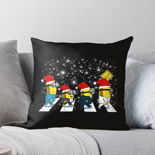 Plush minions walk in Christmas-themed pillow