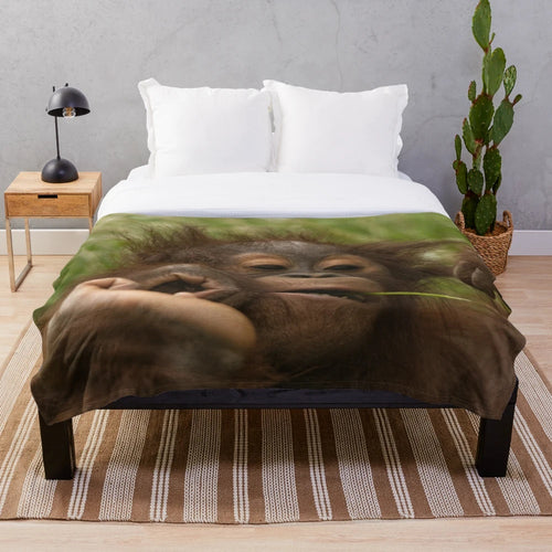 Orangutan baby plush blanket with soft, cuddly design
