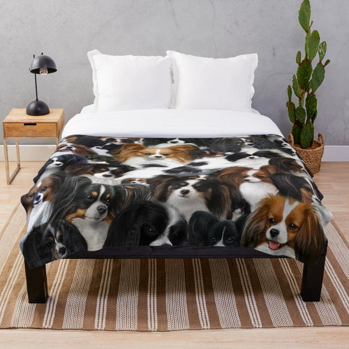 Papillon and Phalene dog collage on a soft, plush blanket