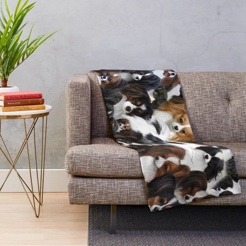 Papillon and Phalene dog collage on a soft, plush blanket