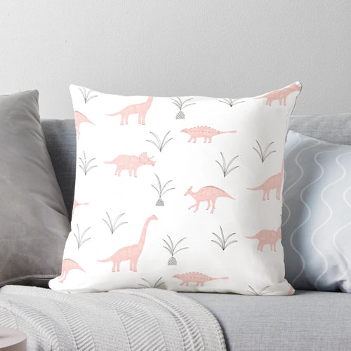 A fluffy pink pillow with a charming dinosaur print, perfect for adding a touch of whimsy to any space.