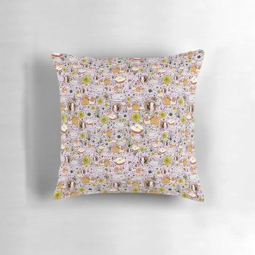 A soft, plush pillow featuring a charming guinea pig design in shades of pink.