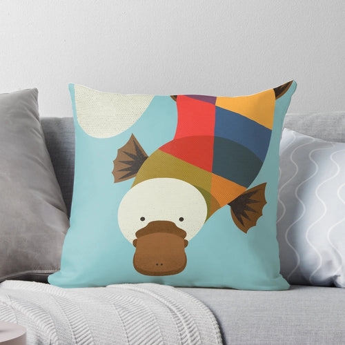 Whimsical platypus-themed decorative pillow with geometric patterns, perfect for a nature-inspired nursery or child's room.