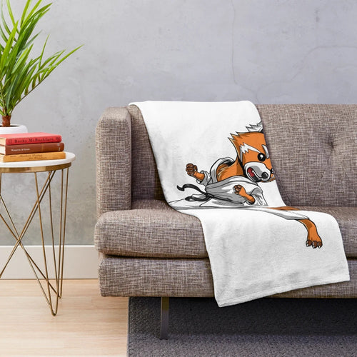 Red panda bear in karate pose on cozy plush blanket