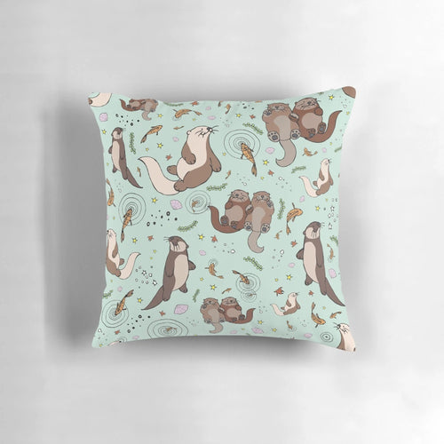 Soft, plush pillow featuring a playful sea otter design, perfect for nature and animal lovers.