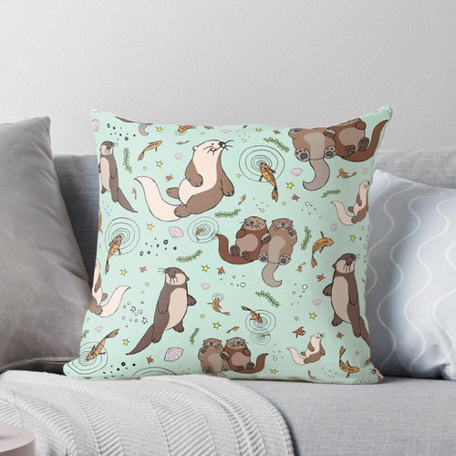 Soft, plush pillow featuring a playful sea otter design, perfect for nature and animal lovers.