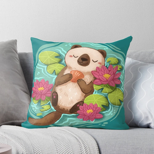 A soft, plush pillow featuring a happy sea otter surrounded by lotus flowers and pond elements.