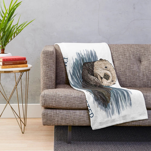 Soft, cozy plush blanket featuring a hand-drawn sea otter sketch design
