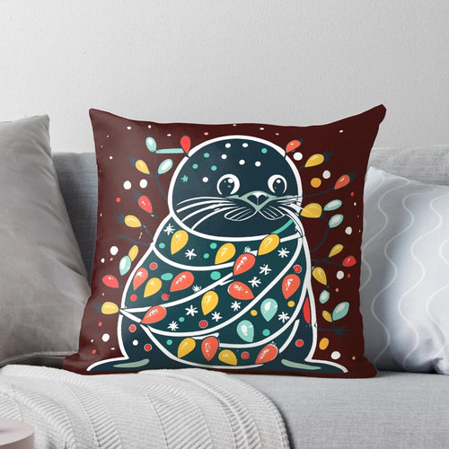Cute and funny seal wearing a santa hat on a Christmas tree-shaped pillow