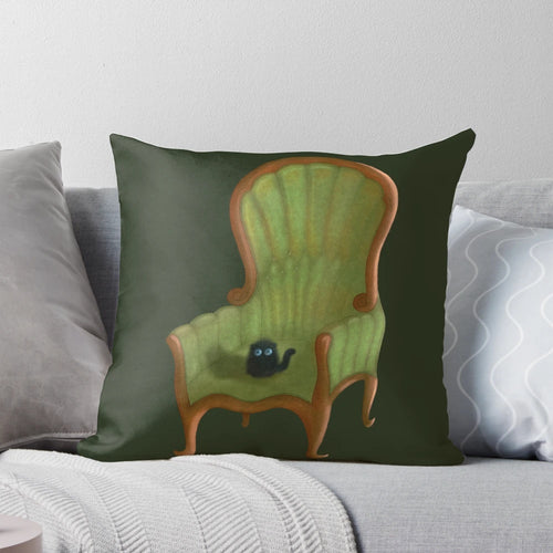 Cute small cat sitting on a pink chair pillow