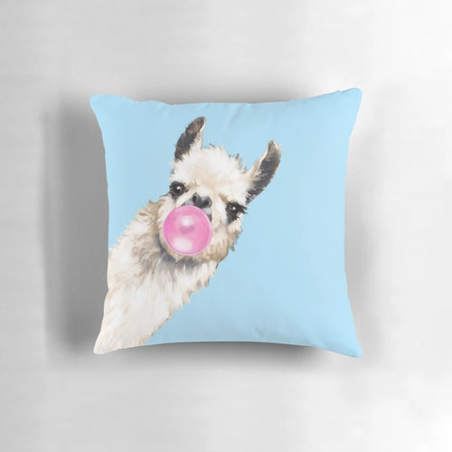 A cute and whimsical pillow featuring a sneaky llama blowing bubble gum in shades of blue and pink.