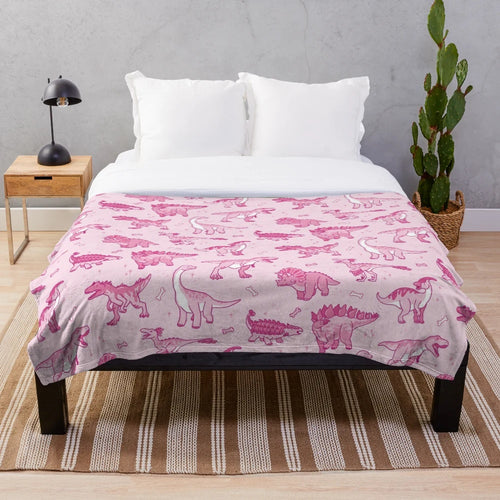Sparkly dinosaur plush blanket featuring a seamless pattern of cute jurassic animals