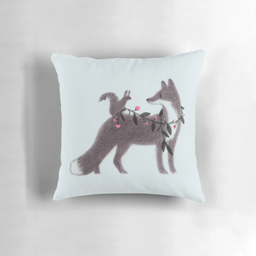Illustrated pillow featuring a squirrel and fox in a sweet, nature-inspired design.