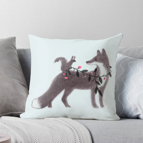 Illustrated pillow featuring a squirrel and fox in a sweet, nature-inspired design.