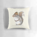 Illustration of a cute, whimsical squirrel wearing an acorn-shaped hat on a decorative pillow.