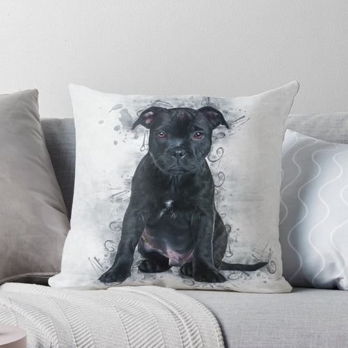 Soft and cuddly Staffordshire Bull Terrier dog breed portrait on a pillow