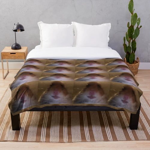 Cozy plush blanket featuring a staring hamster design