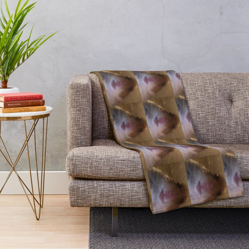 Cozy plush blanket featuring a staring hamster design