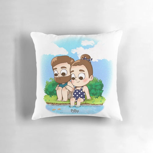 Two people cuddling on a beach with a colorful, kawaii-style pillow