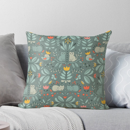 Whimsical illustration of colorful, cartoon-style Swedish folk cats on a decorative pillow.