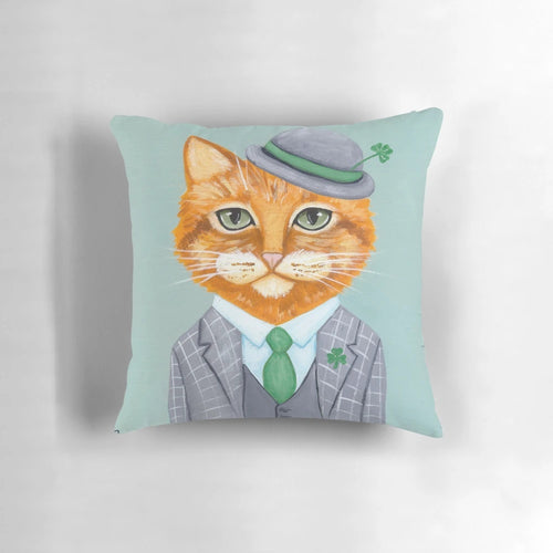 Tiarnan the Tabby Cat Pillow wearing a green shamrock suit and clover accessories