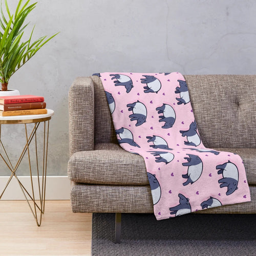 Soft and cuddly plush blanket featuring a cute tapir with a heart pattern design