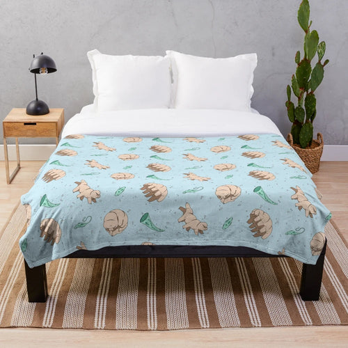 Tardigrades and other cute microscopic animals printed on a soft, plush blanket