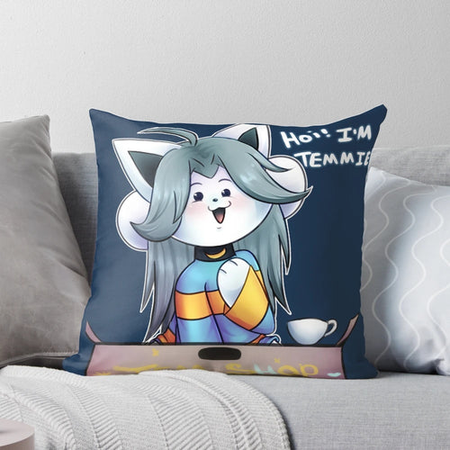 A fluffy, white pillow featuring the iconic Temmie character from the game Undertale.